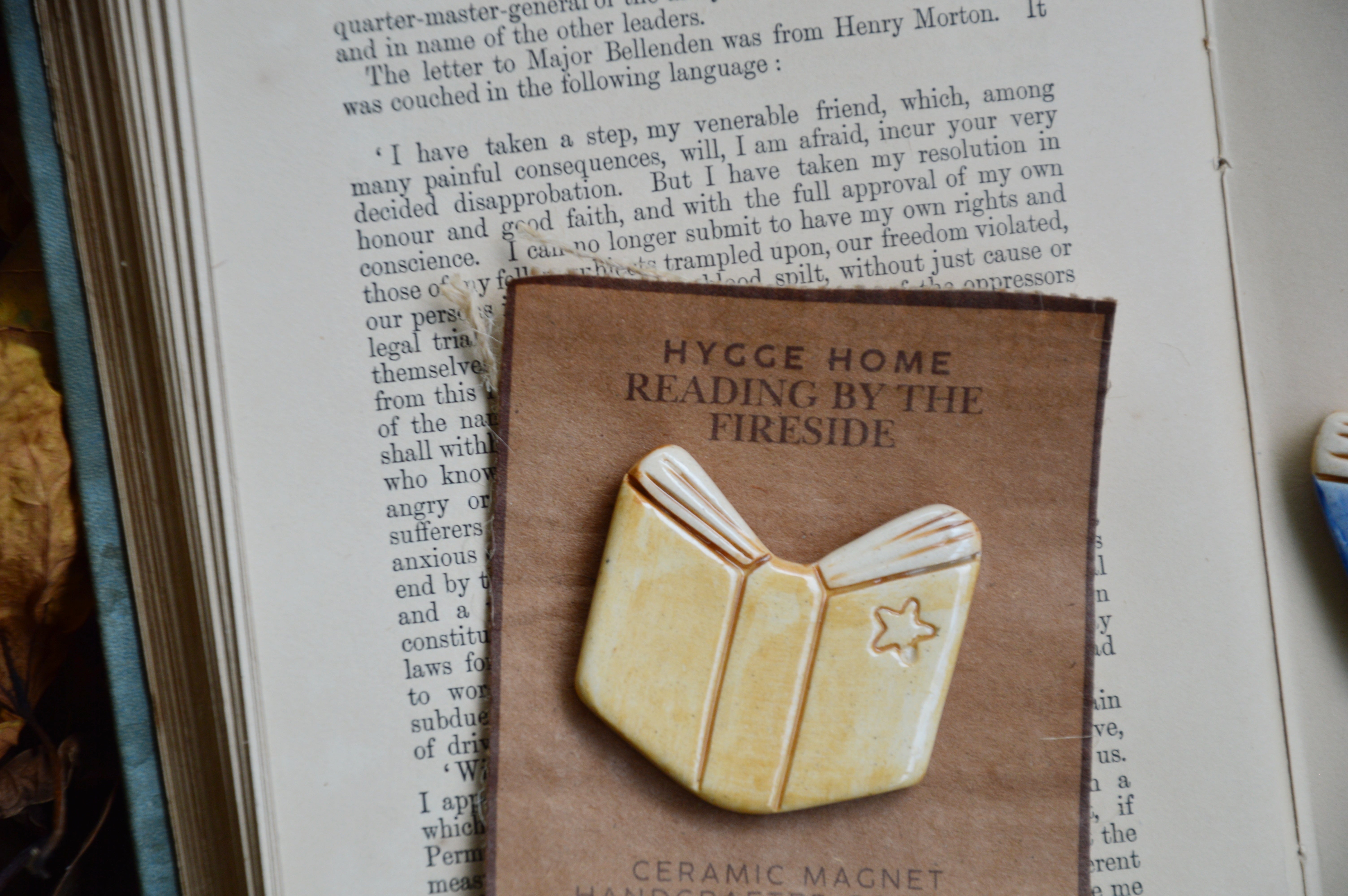 Reading By The Fireside | Hygge Home Ceramic Magnet | Beige Book