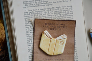 Reading By The Fireside | Hygge Home Ceramic Magnet | Beige Book