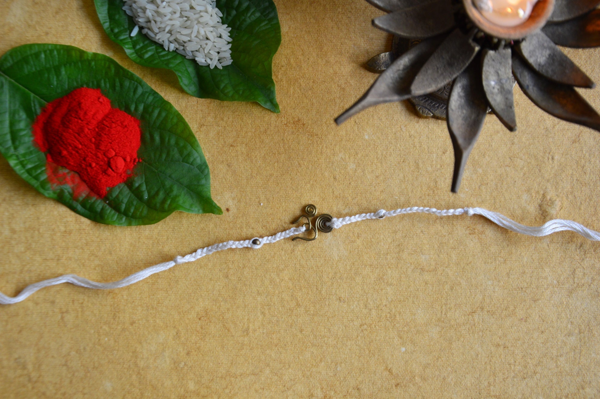 Om Rakhi | Off White Dori