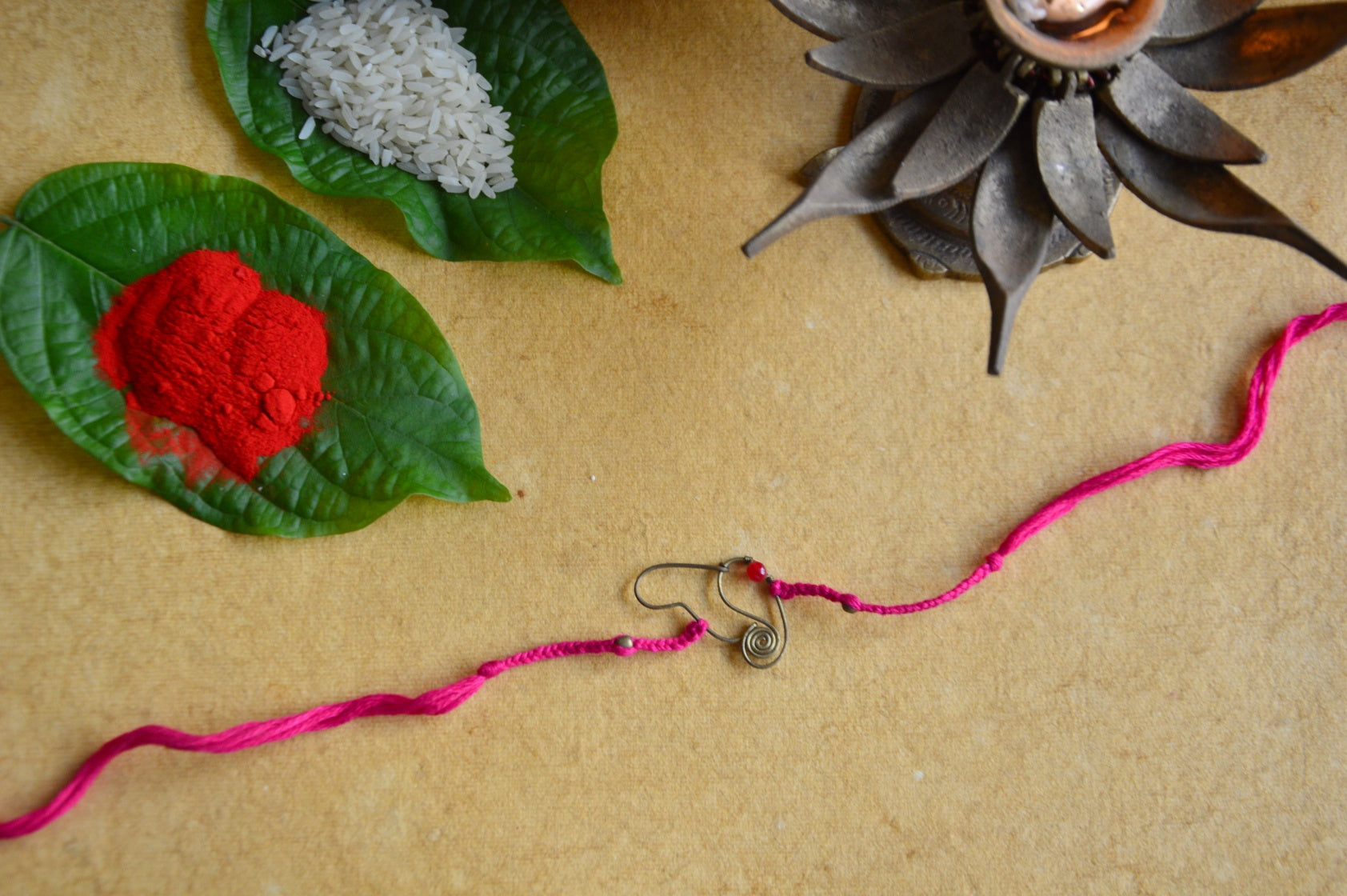 Ganesha Rakhi | Pink Dori