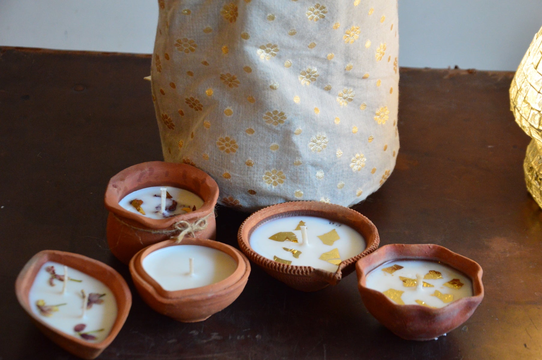 Festive Gift Bag with 10 assorted terracotta diyas | White Zari